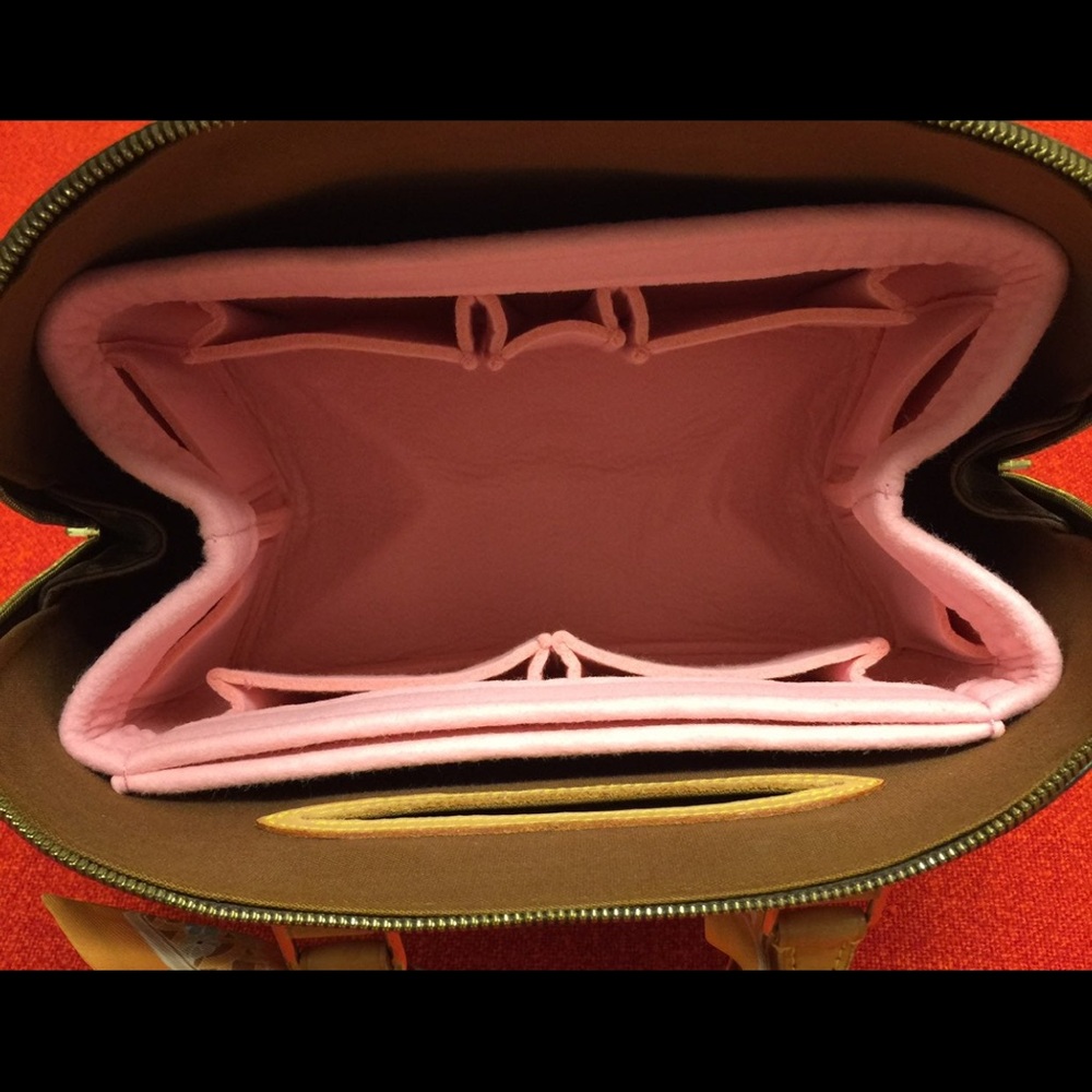 Authentic Louis Vuitton Alma monogram bag was authenticated/conditioned at LV